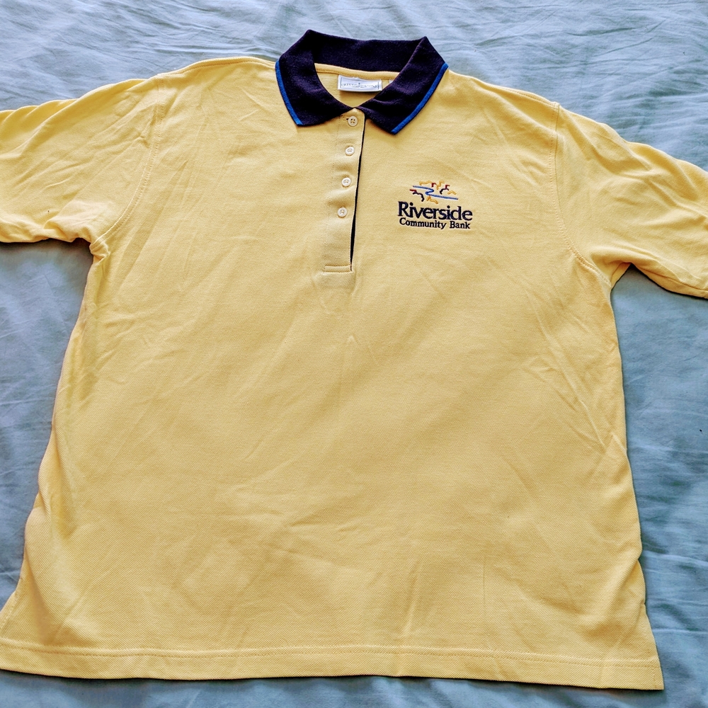 Yellow Polo Shirt with Riverside Community Bank Logo on the front.